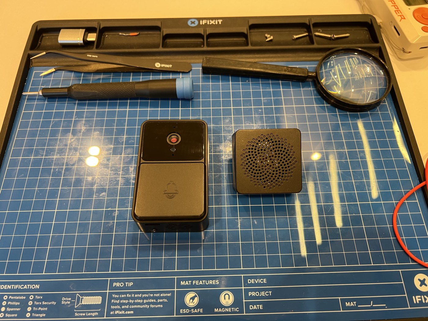 The Smart Doorbell X3 and its sub-GHz indoor receiver on a workbench