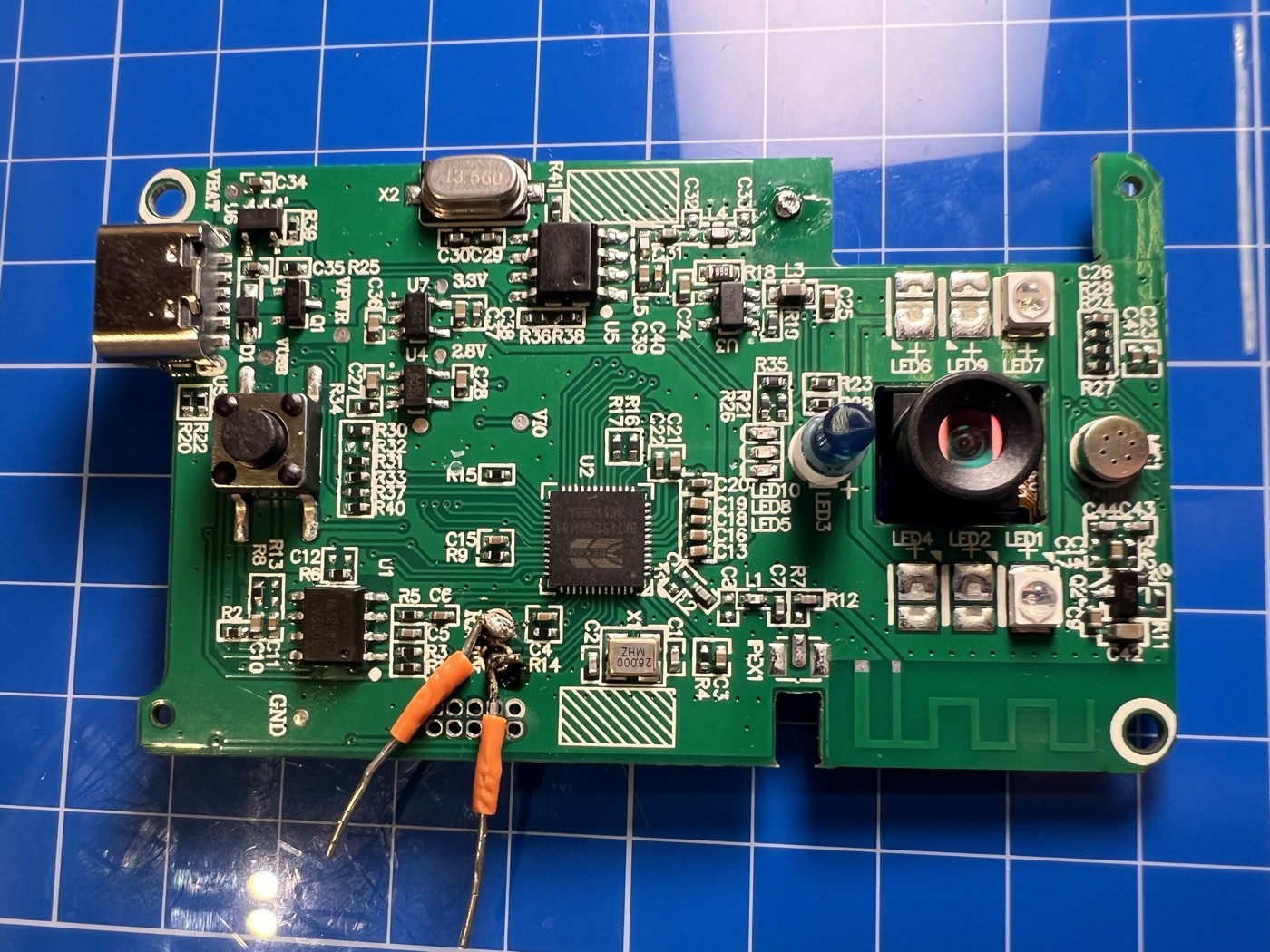 Small wires soldered to the TX and RX UART pads on the doorbell PCB